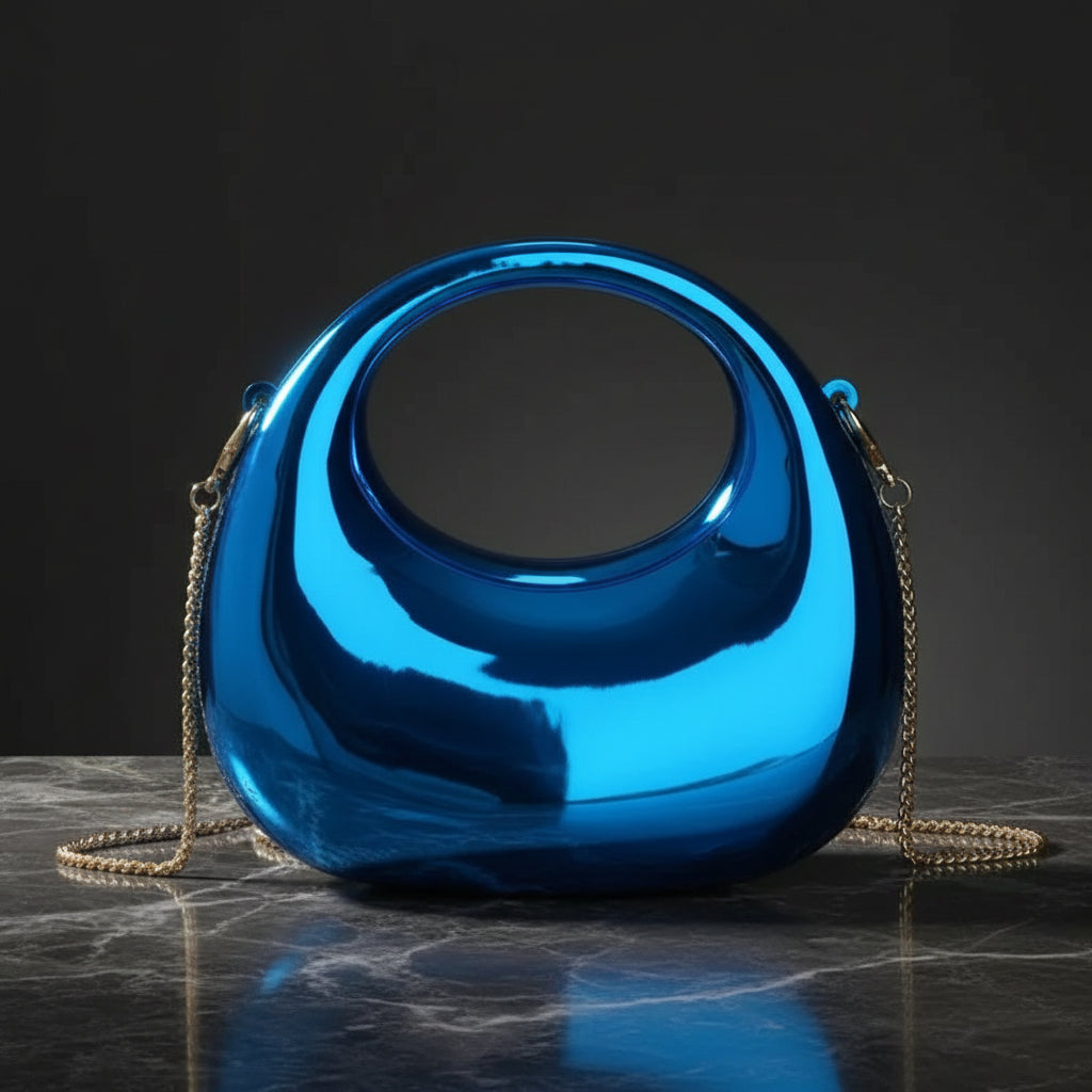 Blue metallic handbag with a chain strap on a white background
